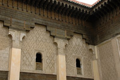 intricately carved cedar wood and plaster of the walls