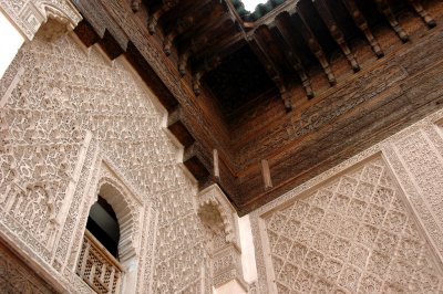 intricately carved cedar wood and plaster of the walls