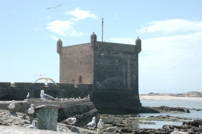 This square tower, with little turrets in each corner, is quite different in style to the circular north and south bastions.