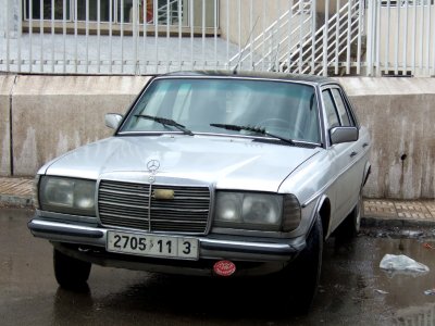 a grand taxi, takes in 2 passengers in front, and 3 at the back