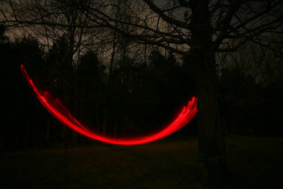 Carson in Swing with red flashlight