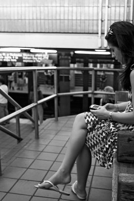 woman waiting for subway train 01