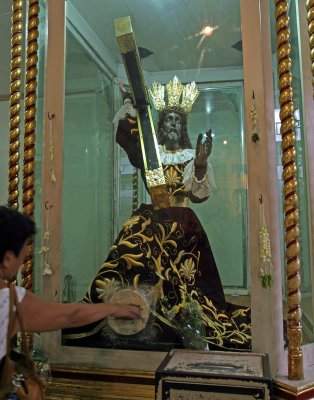 Touching the feet of the Black Nazarene in Quiapo