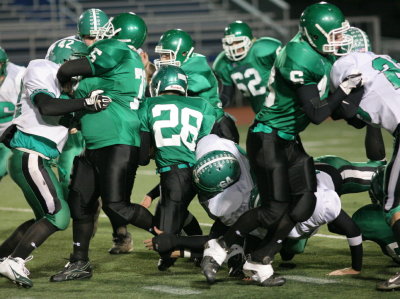 Chris Perry getting tackled by Greene's Jesus Mares