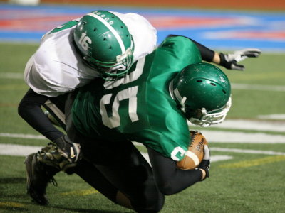 Chris Furner tackled by Greene's John Carlin after a pass reception