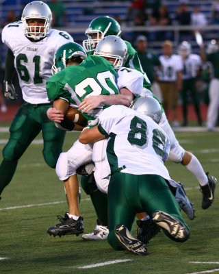 Newfield's Dillon Shults and Zac Giampaolo tackling Seton's Chris Perry
