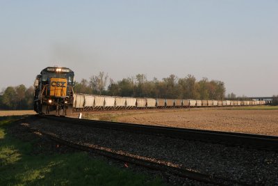A NB grain train rounds the curve at St James.