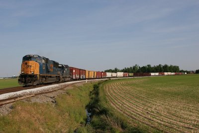 NB train emerges from under interstate 64 and rounds the curve at St. James.