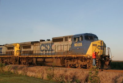 The conductor of watches the crossing as this grain train combines two dead trains in preparation to go south to Evansville