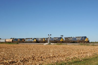 A SB train overtakes a parked grain train as it blasts through the 268.4 signal at middle Kings.