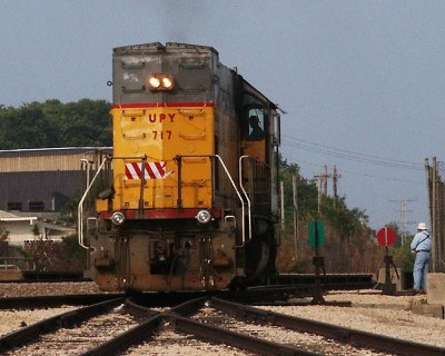 Conductor John throws switch for Local UP Engine 717 at Sterling.JPG