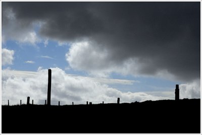 Fence Posts & Storm Clouds