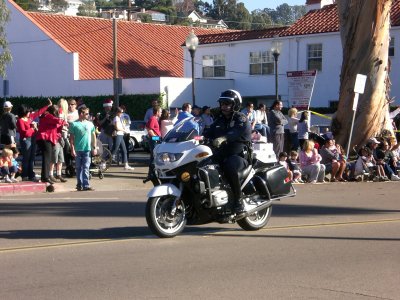 The man leads off the ground portion of the parade