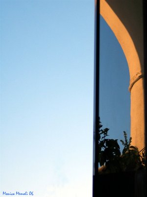 Arch reflection in sunset light.no more sailboat