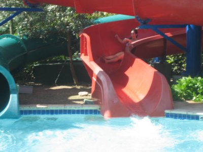 Mommy slip-sliding into the pool