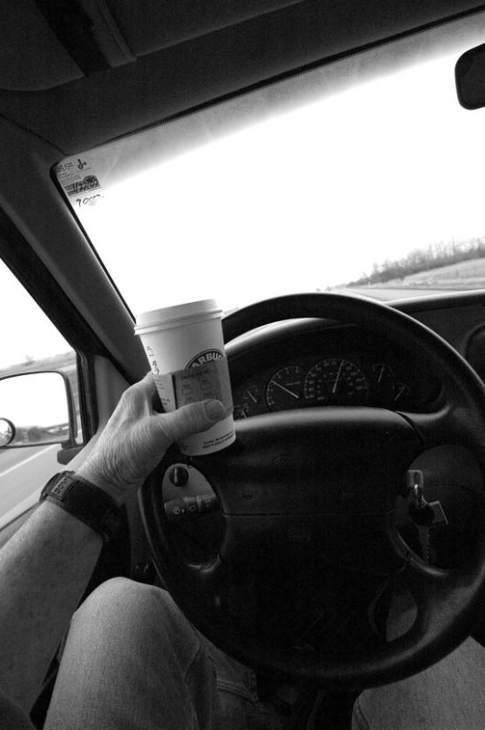 Coffee, a scone, good cd, cell phone, camera,, driving, sight-seeing, = multi tasking