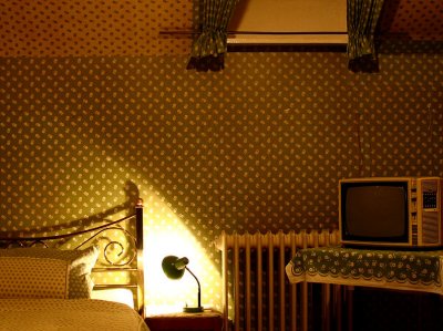 room with radiator and tv