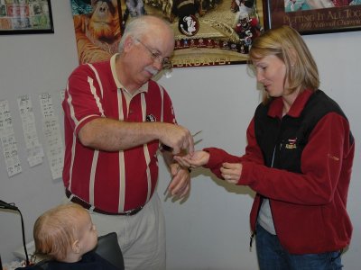 Mom gets the first lock of Brooks' hair