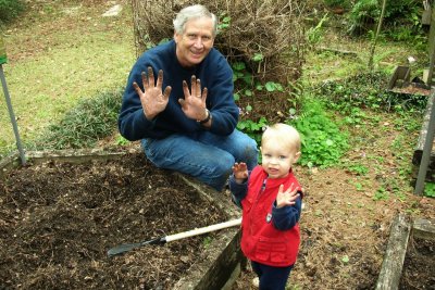 Brooks and Papa planting potatoes