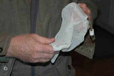 Removing bird from mesh bag