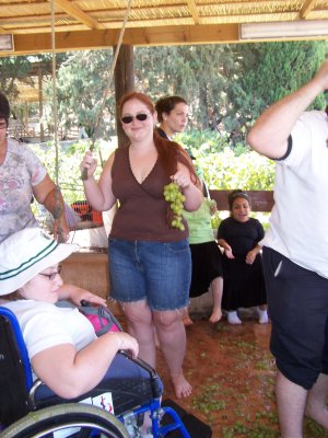 Alli and Rita squish grapes