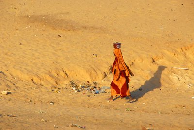 Woman in a colorful dress against the desert