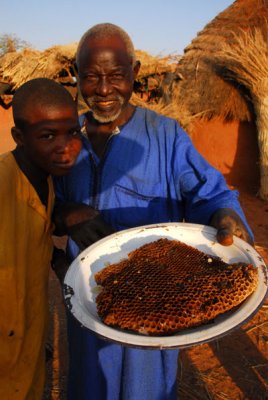 For the only time in our trip, the villagers present us with a gift - fresh honey