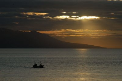 Ship headed for port at sunset, Húsavík