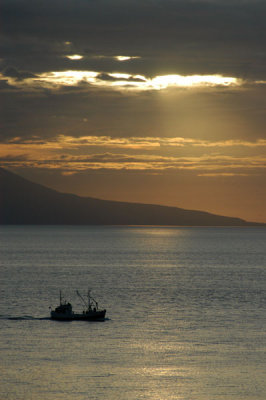 Ship headed for port at sunset, Húsavík