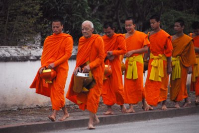 The monks of Luang Prabang rise early each day to collect alms at 6 am
