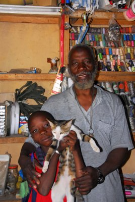 Mr. Bakary Traoz, shopkeeper with his son, Kayes