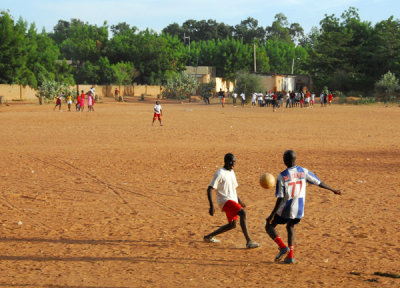 Soccer on a dirt field, Sgou, Mali