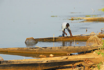 Man tending his boat, Mali