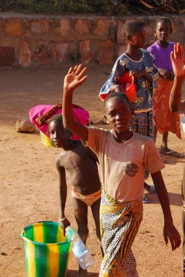 Girl in Babaroto, Mali, waving