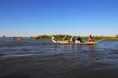 Our little flotilla heading down the Niger River