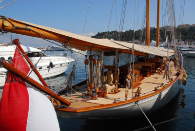 Classy Monaco-flagged wooden sailboat