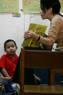 One of the moms reads to the kids