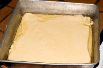 batter added to hot grease in pan