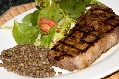 strip steak, salad and lentils