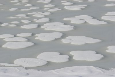 Snow on frozen pond