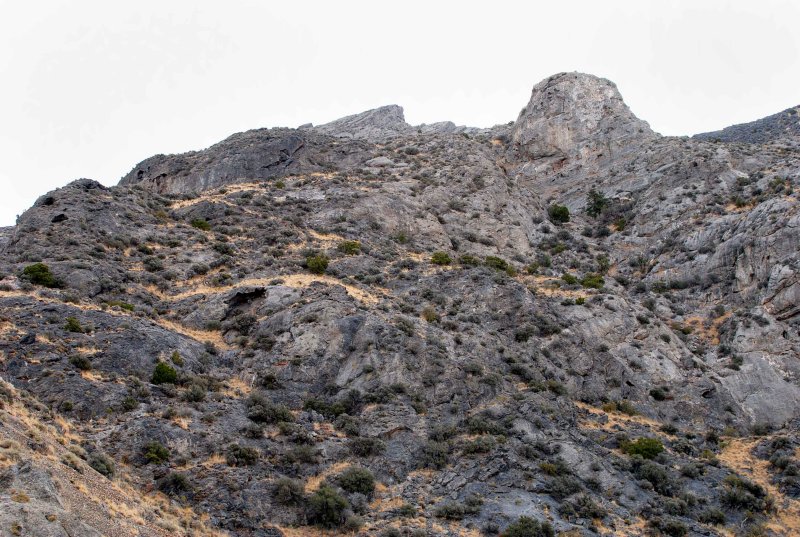 The route up goes across this slope, but is there a drop-off to the right of the tower?