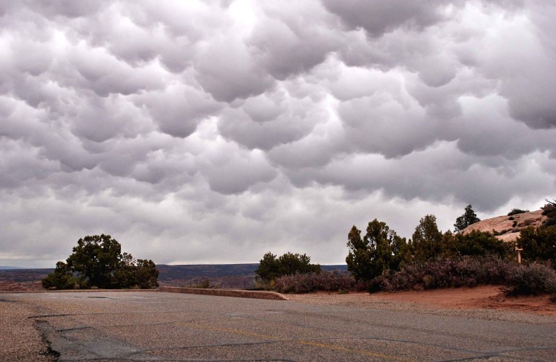 Parking lot quivers under a forboding sky