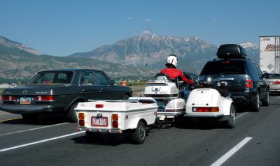 Motorcycle with trailer and (occupied) side car