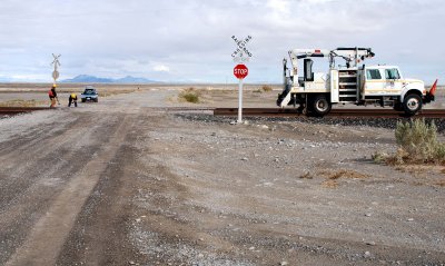 Repairing a STOP sign at the grade crossing at Knolls, Utah
