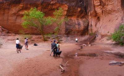 People at the stream's source under Morning Glory Natural Bridge