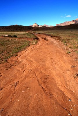 Follow the orange-red road (to Blue Castle Canyon)