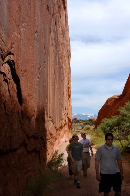 People and wall (the side of a fin) near the trailhead