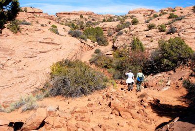 Hikers on their way to Delicate Arch