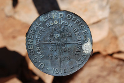 Survey post marker, installed in 1912, showing its position in the township-and-range system