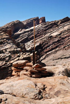 Survey post installed near a precipice (just behind the rocks); height of bamboo is 6 feet (1.8m)